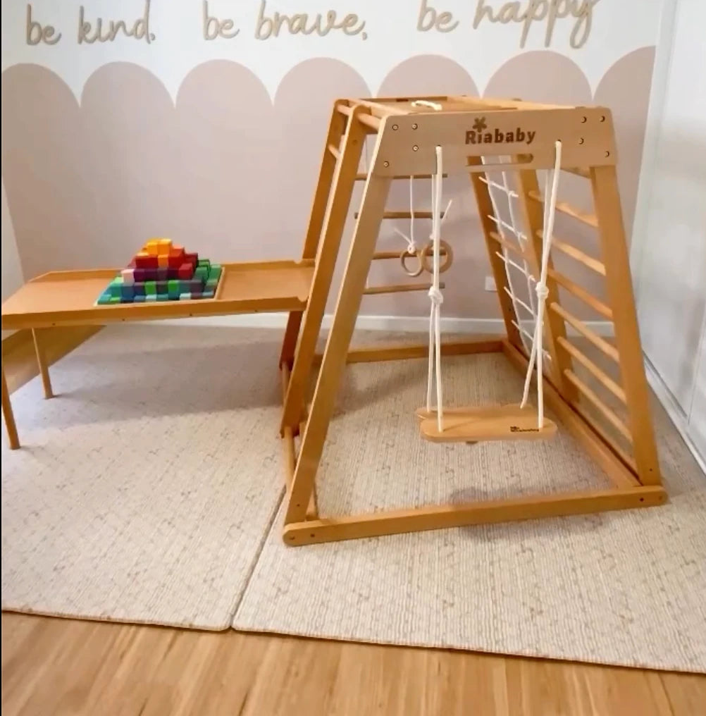 Reversible Kangaroo slide used as a table, supported by its two included legs at the outer end and by the playhouse at the other end