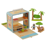 Wooden Beach House play scene arranged with hammock, palm trees, furniture and miniature figures