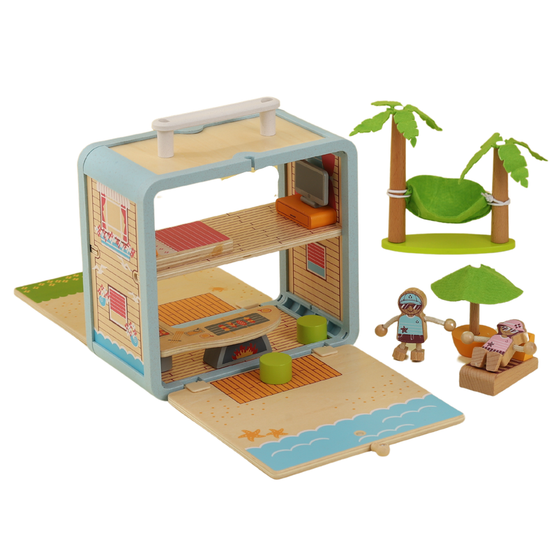 Wooden Beach House play scene arranged with hammock, palm trees, furniture and miniature figures
