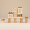 Set of wooden building blocks arranged to form a small castle on a white background