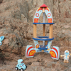 Wooden toy rocket with astronauts on a rocky background