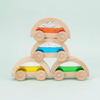 Set of wooden cars with colorful transparent bodies on a white background