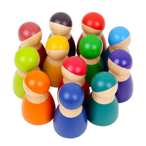 Colorful wooden peg dolls on a white background
