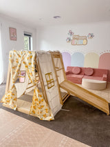 Kiddie Glamping Tent fitted over a Kangaroo Playhouse with the entrance open and slide attached