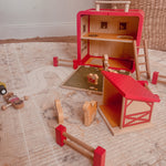 Wooden Farm House GoBox opened to show the barn, ladder, fences and farm animals