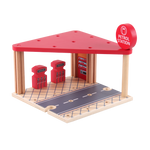 Close view of the wooden petrol station with fuel pumps, cars and roadway