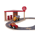Wooden Petrol Station arranged as a road play scene with cars, pumps and connected track pieces
