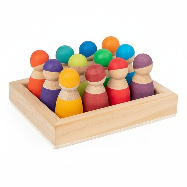 Twelve colourful wooden rainbow peg dolls arranged in their wooden storage tray
