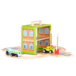 Wooden Train Set arranged as a railway scene with station, tracks and train carriages