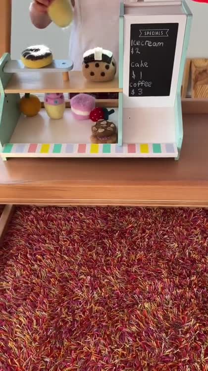 Pretend café play on the Koala Playhouse