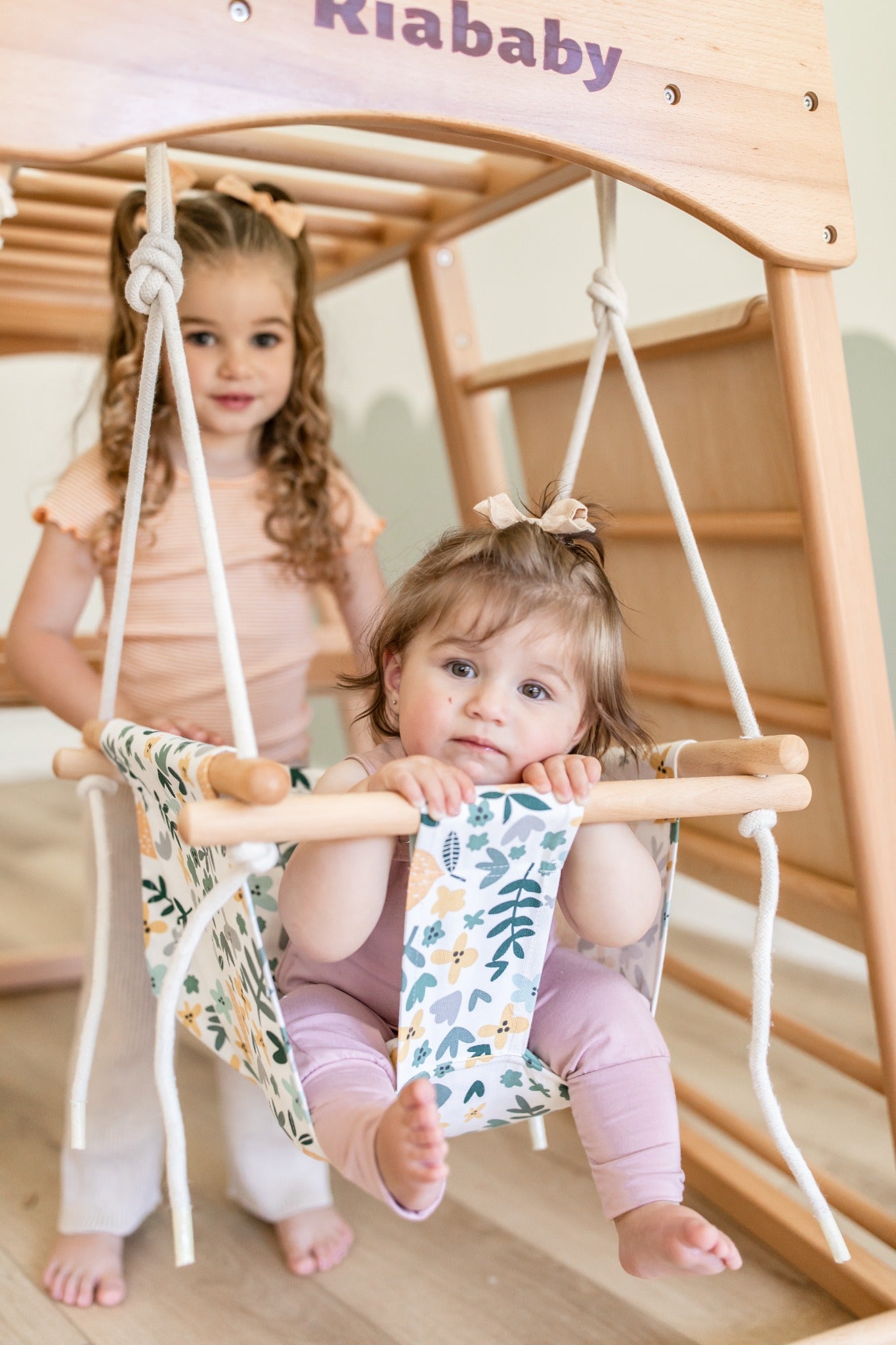 Cushioned baby swing in use