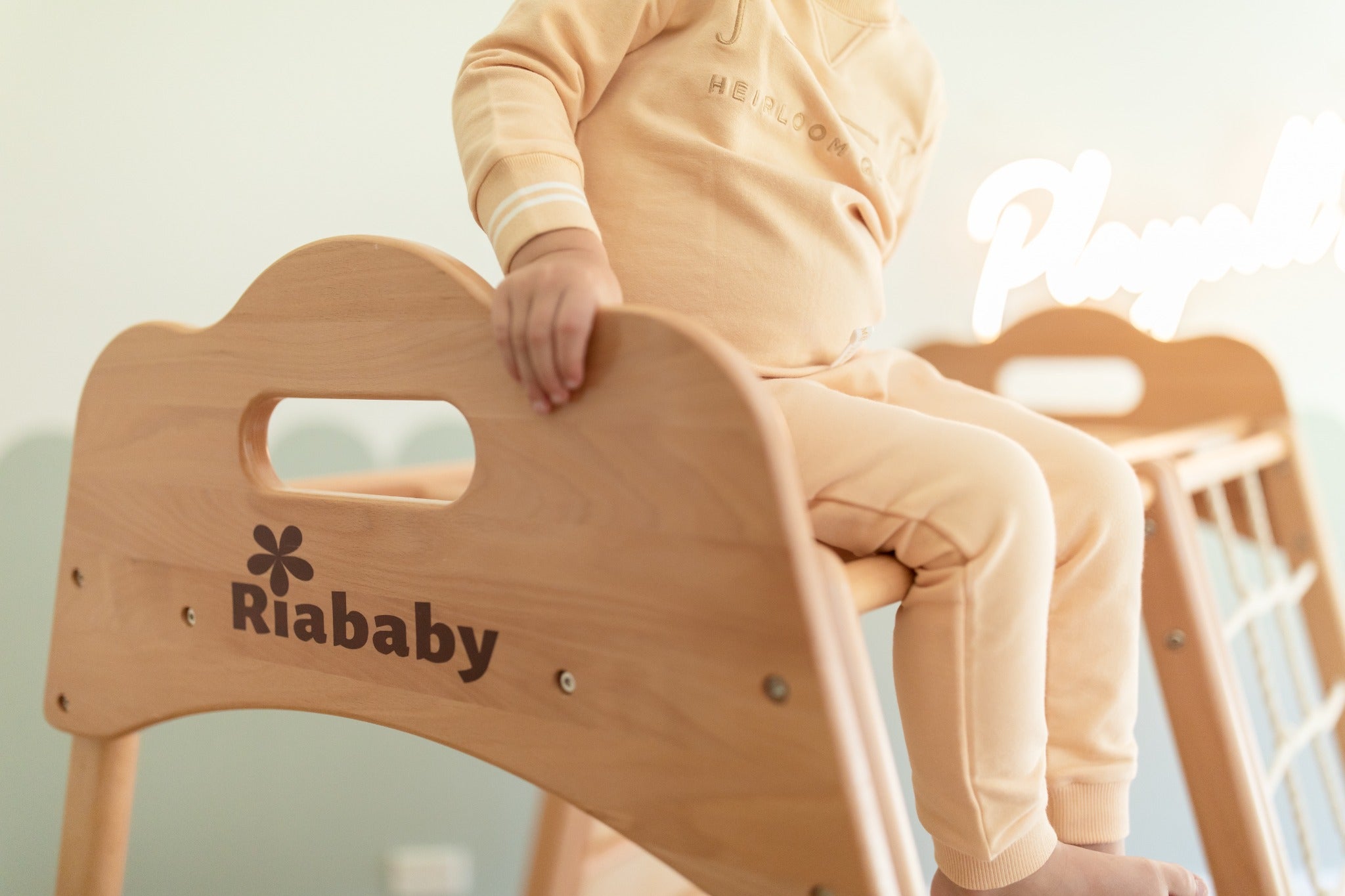 Rounded beechwood cloud panel and handhold detail on the Koala Playhouse