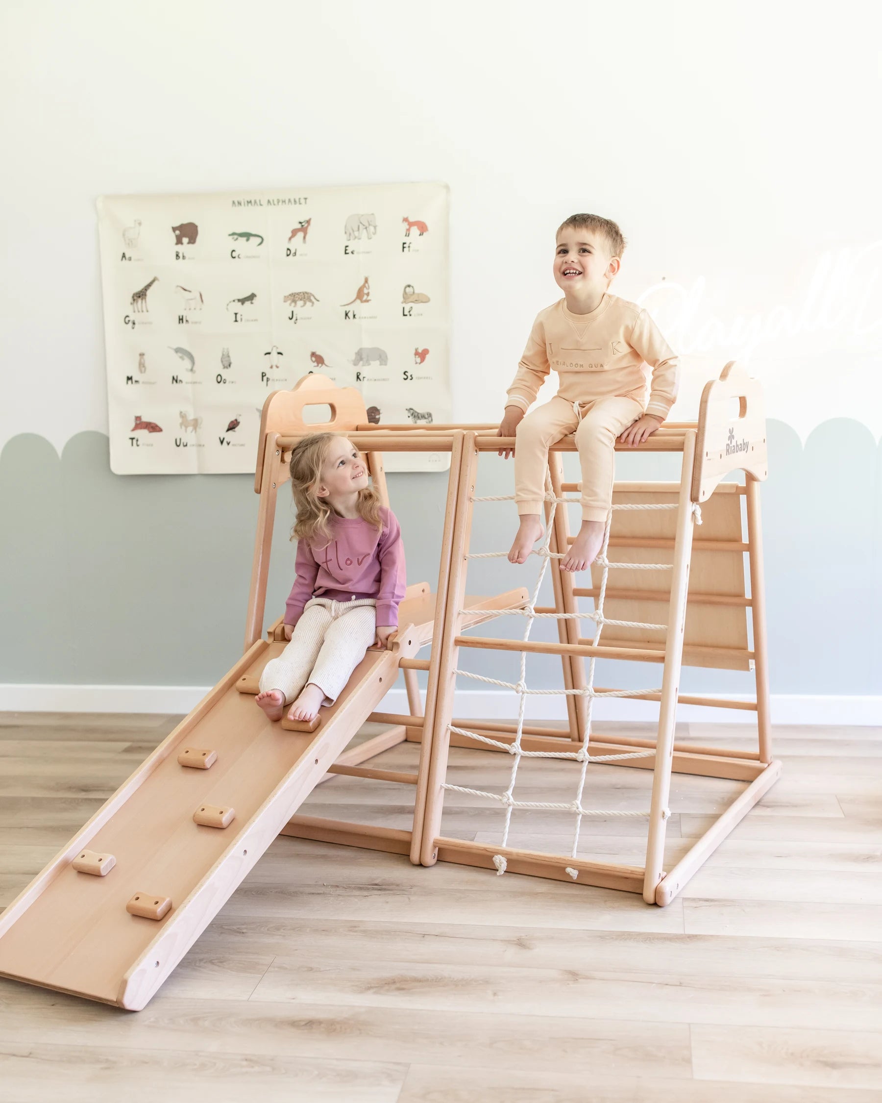 Children enjoying a Koala climbing playhouse in a bright playroom